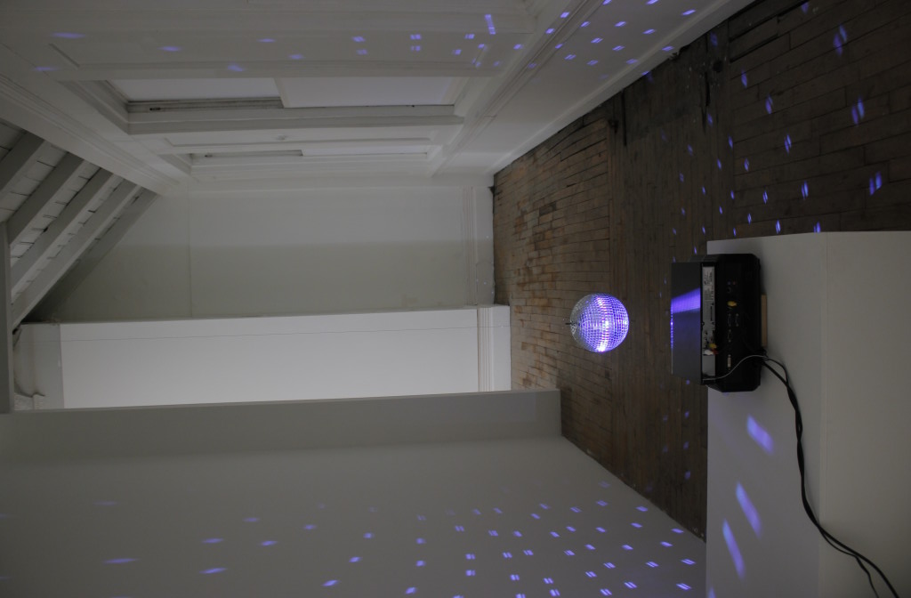 Conrad Ventur, Untitled (Amanda Lear, "Follow Me"), 2015. Mixed media installation: mirror ball, motor, wire, projected video animation using footage found on Youtube. Courtesy of the artist.