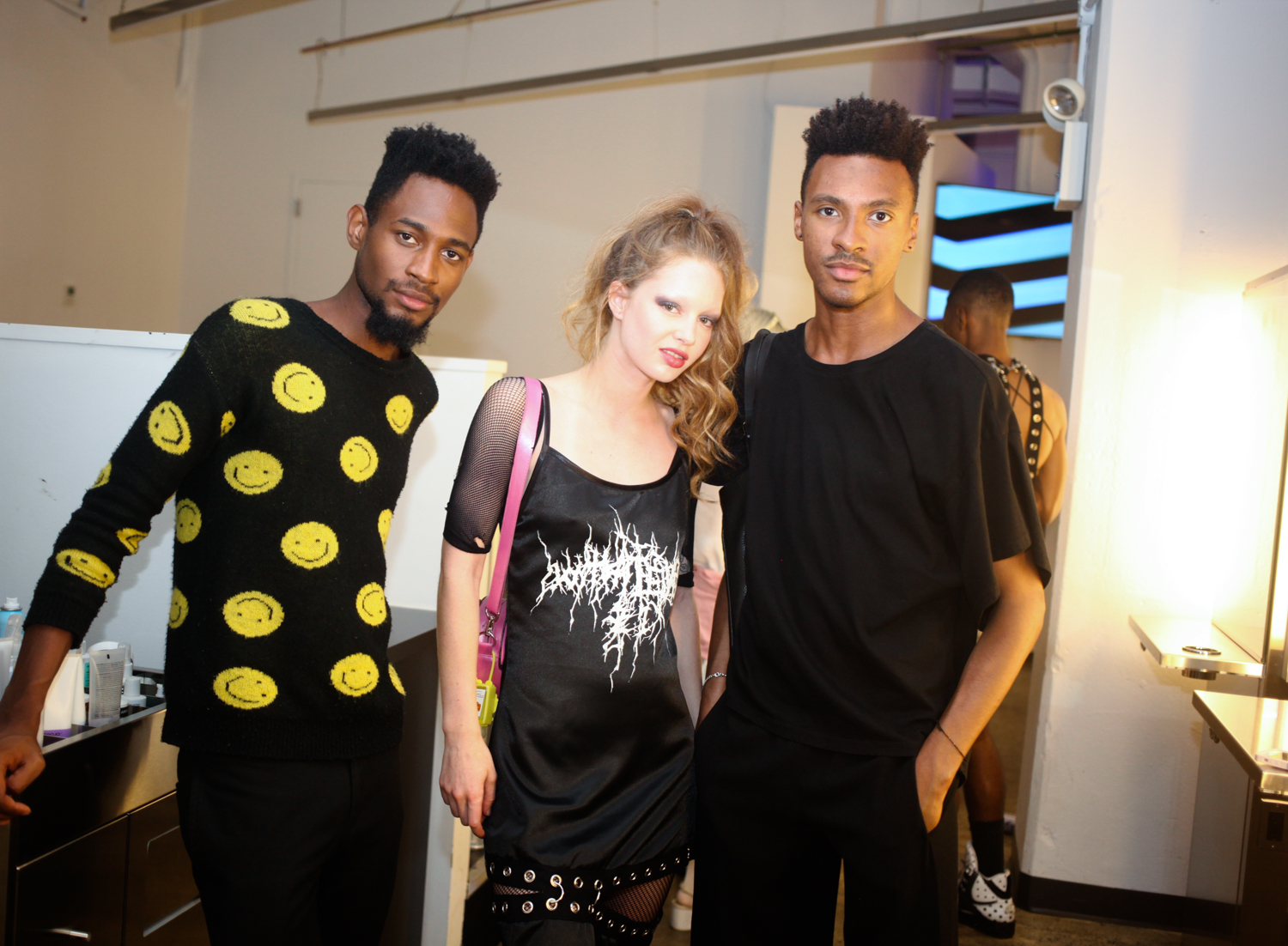 Model wearing Whatever 21 (middle) with attendees